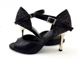 Alya Tanzschuhe in Schwarz Glitter von Dancing Queens: Schwarz mit glitzernder Rückseite, goldenem Absatz und Schnallenriemen.