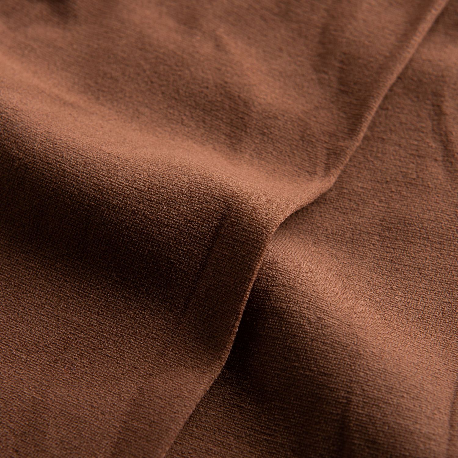 Nahaufnahme der zerknitterten Textur der 108 Economy Ballettstrumpfhose von Rumpf in Noisette mit sichtbaren Falten und Schatten.