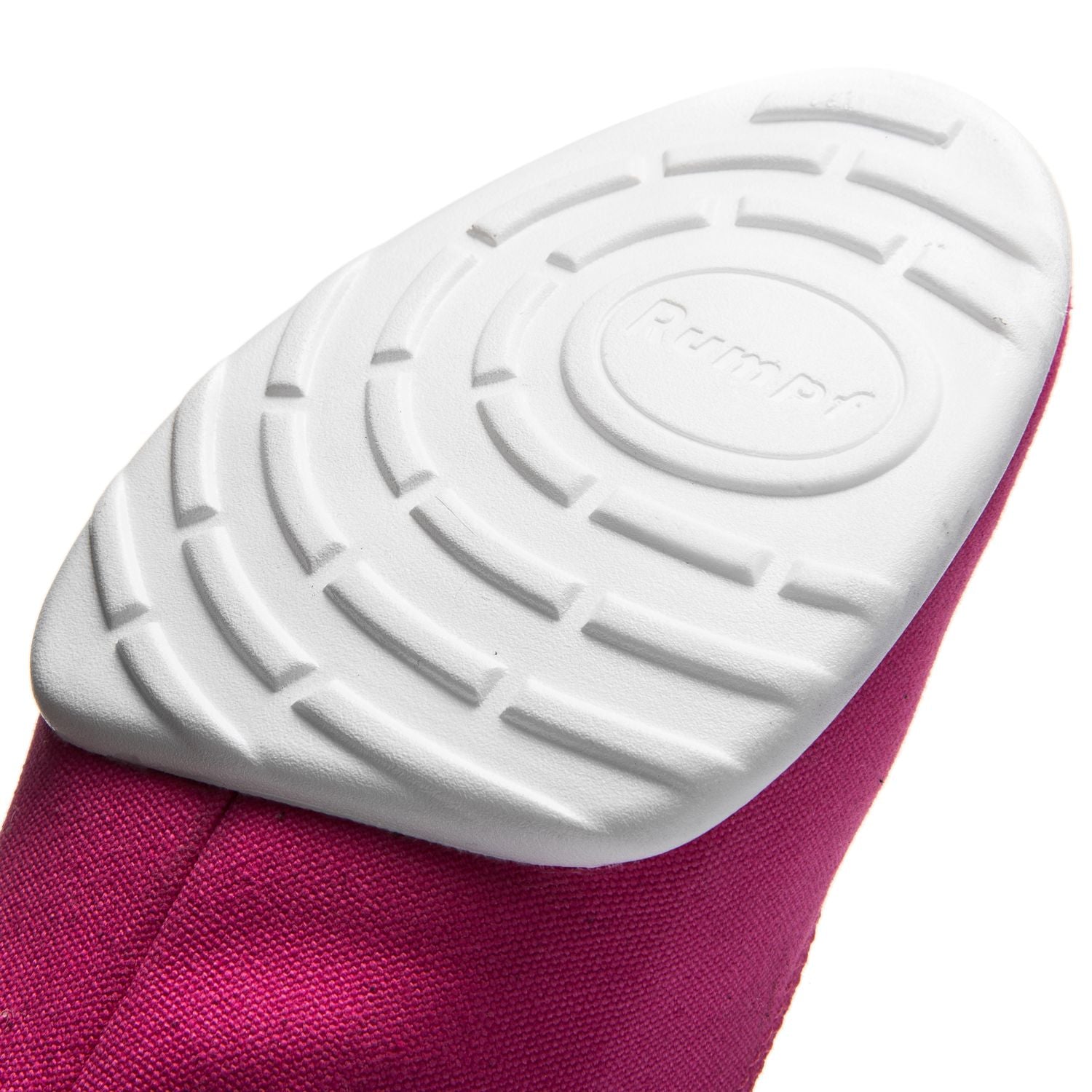 Nahaufnahme einer 1515 Rumpf Bee Sneaker-Sohle in Fuchsia mit kreisförmigen Mustern auf leuchtend rosa Stoff.