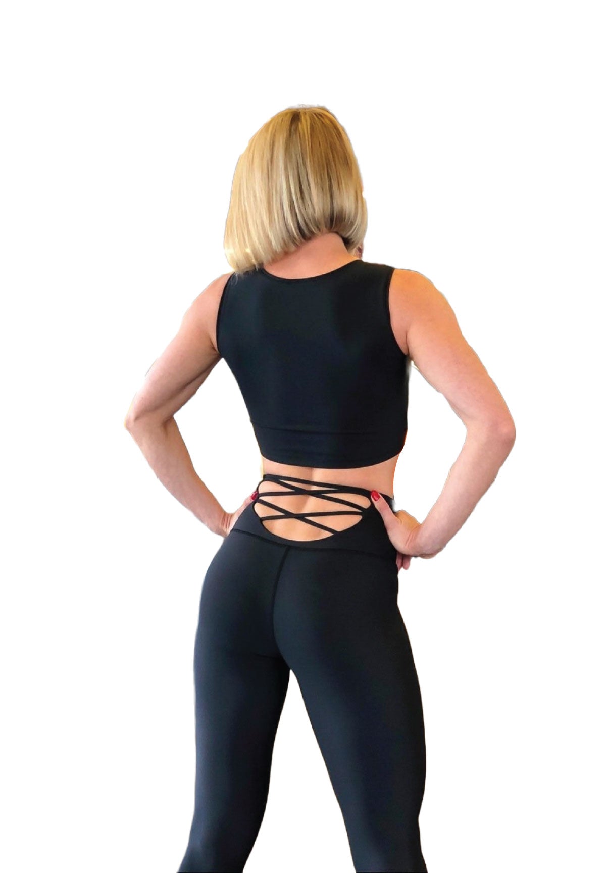 Die Person trägt Lisminas 297 High Waist Leggings in Schwarz und steht mit den Händen in den Hüften vor einem weißen Hintergrund.